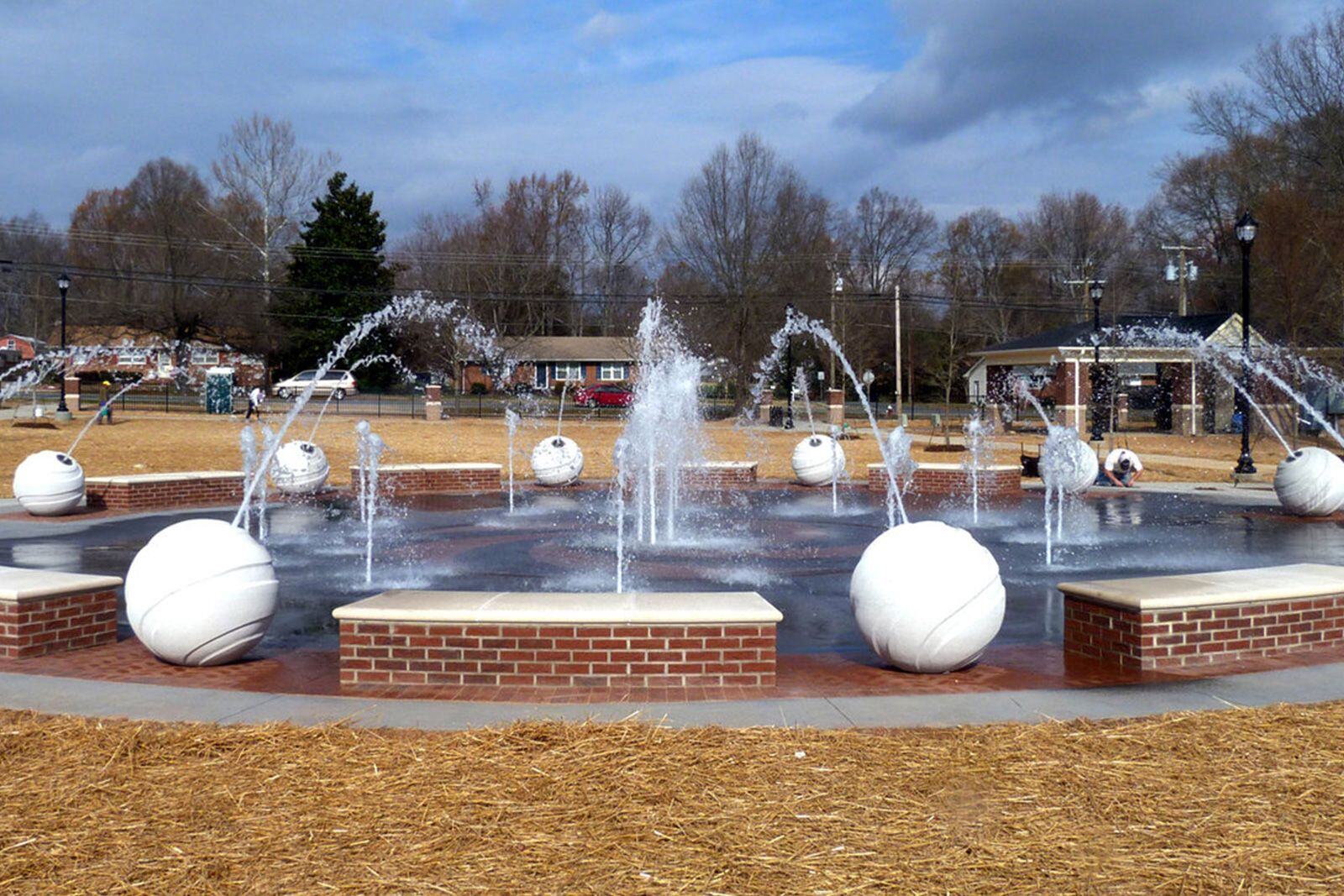 Outdoor fountain with water features designed for interactive play