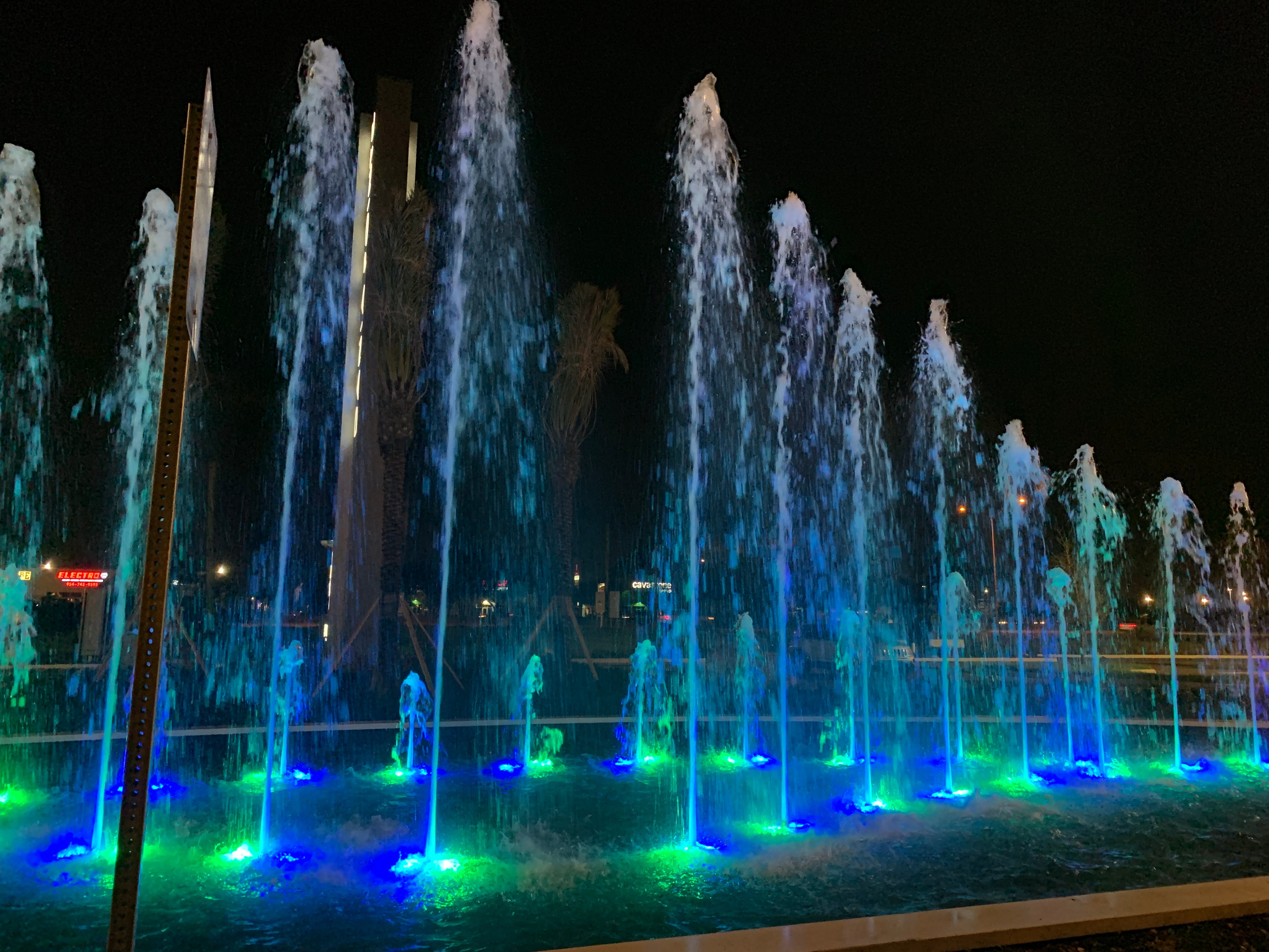 Fountain jets and lights at night